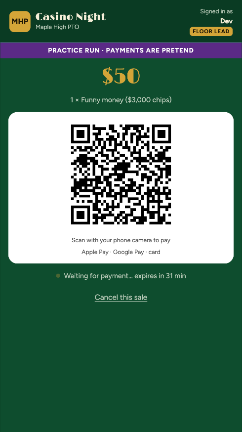 A volunteer phone showing a QR code waiting for payment